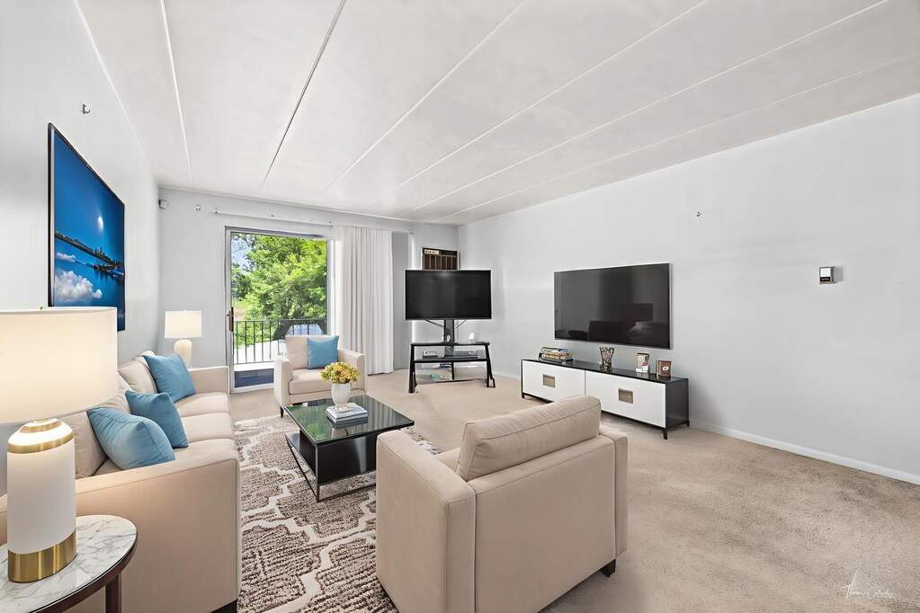 Lansing Apartments — Living Room with Balcony Access