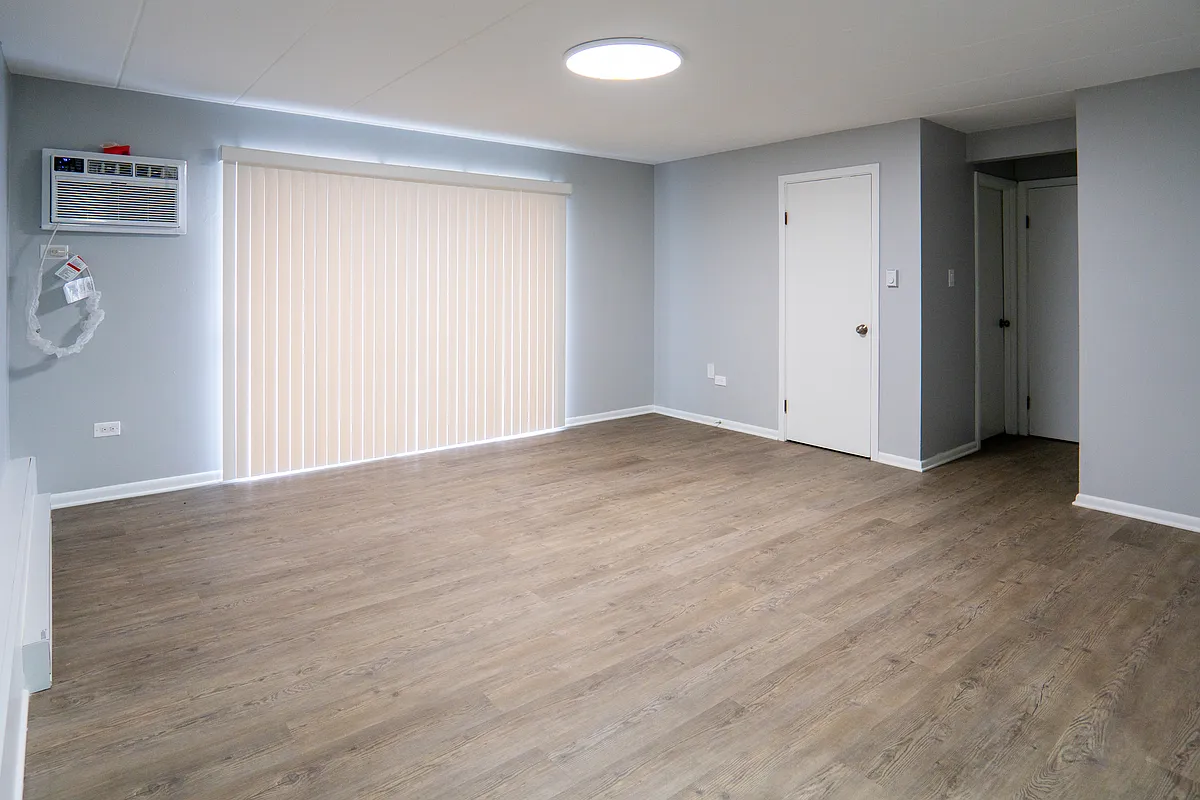 Lansing Apartments — Bright Living Room with Vinyl Flooring