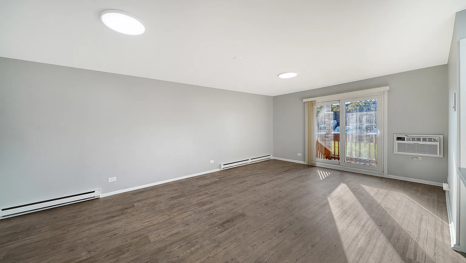 Richton Park — Living Room with Balcony Access